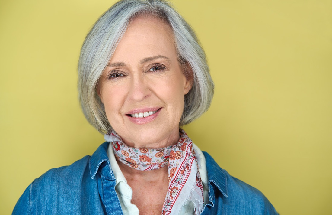Actor headshot against a yellow backdrop