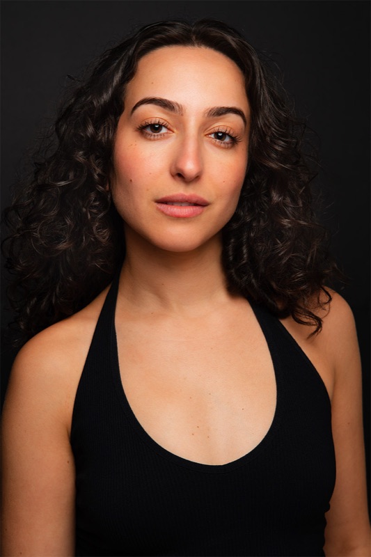 Dramatic actor headshot on a dark backdrop